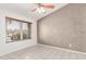 Bedroom with accent wall, tile flooring, and a window with blinds at 4110 W Villa Linda Dr, Glendale, AZ 85310
