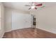 This bright bedroom offers wood floors, ceiling fan and closet for ample storage space at 4110 W Villa Linda Dr, Glendale, AZ 85310