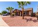 Inviting home featuring desert landscaping, mature palm trees, and a well-maintained lawn at 4110 W Villa Linda Dr, Glendale, AZ 85310