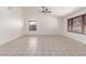 Bright living room features tile flooring, vaulted ceilings, and ample natural light at 4110 W Villa Linda Dr, Glendale, AZ 85310