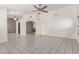 Spacious open-concept living room features tile flooring, neutral walls, and seamlessly connects to the kitchen at 4110 W Villa Linda Dr, Glendale, AZ 85310