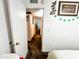 Hallway leading to bedroom shows proximity to the bathroom and additional bedrooms at 4623 W Mission Ln, Glendale, AZ 85302