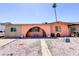 Charming single-story home featuring a unique arched entryway and low-maintenance landscaping at 4623 W Mission Ln, Glendale, AZ 85302