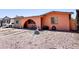 View of the single-story home featuring desert landscaping with rock features and an arched entryway at 4623 W Mission Ln, Glendale, AZ 85302