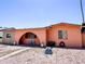 Single-story home featuring low-maintenance landscaping, an arched entryway, and a welcoming facade at 4623 W Mission Ln, Glendale, AZ 85302