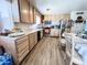 Bright kitchen features stainless appliances, wood cabinets, laminate countertops and flooring at 4623 W Mission Ln, Glendale, AZ 85302