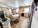 Well-lit kitchen and dining area with light wood cabinets, stainless steel appliances, and tile floors at 4623 W Mission Ln, Glendale, AZ 85302