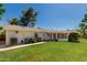 Expansive backyard with well-maintained lawn and a covered patio area at 5118 E Mulberry Dr, Phoenix, AZ 85018
