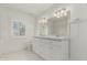 Bright bathroom with double vanity, marble countertop and tiled flooring at 5118 E Mulberry Dr, Phoenix, AZ 85018
