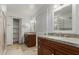 Bathroom featuring double vanity with granite counters and dark wood cabinetry at 5118 E Mulberry Dr, Phoenix, AZ 85018