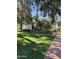 Charming home with a lush green lawn, brick walkway, and beautiful landscaping, creating a welcoming and picturesque exterior at 5118 E Mulberry Dr, Phoenix, AZ 85018