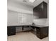 Well-lit office space with built-in dark wood desk and cabinetry at 5118 E Mulberry Dr, Phoenix, AZ 85018