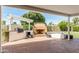 Covered brick patio featuring a brick fireplace and outdoor seating area at 5118 E Mulberry Dr, Phoenix, AZ 85018