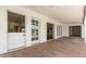 Covered brick patio with multiple access points to the home's interior spaces at 5118 E Mulberry Dr, Phoenix, AZ 85018