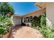 Brick patio with well manicured hedges and white exterior at 5118 E Mulberry Dr, Phoenix, AZ 85018