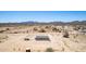 Desert home aerial view showcasing the landscape and home's placement at 52680 W Meadow Green Rd, Maricopa, AZ 85139