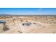 Aerial view of desert home and lot with a fence and desert foliage at 52680 W Meadow Green Rd, Maricopa, AZ 85139