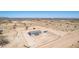 An aerial perspective highlighting a rural home with acreage in a serene desert setting at 52680 W Meadow Green Rd, Maricopa, AZ 85139