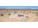 Rural home aerial view showcasing the fenced yard and desert landscape at 52680 W Meadow Green Rd, Maricopa, AZ 85139