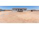 Single-story home with desert surroundings and a covered front porch at 52680 W Meadow Green Rd, Maricopa, AZ 85139