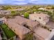Sprawling desert community featuring houses with tile roofs, desert landscaping, putting green, and beautiful mountain views at 5428 E Windstone Trl, Cave Creek, AZ 85331