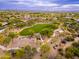 Beautiful aerial view showcasing community park with playground, basketball court, and green spaces at 5428 E Windstone Trl, Cave Creek, AZ 85331