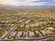 A high up aerial view of the property in a planned community with pools, mature landscaping and mountain views at 5428 E Windstone Trl, Cave Creek, AZ 85331