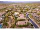 Expansive aerial view showcases the community's landscaping and the home's inviting backyard with its desert surroundings at 5428 E Windstone Trl, Cave Creek, AZ 85331