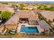 Private backyard features a sparkling pool, covered patio, and barbecue area perfect for entertaining at 5428 E Windstone Trl, Cave Creek, AZ 85331
