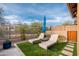Backyard features an outdoor lounge area with a grill and patio for relaxing, with desert landscaping at 5428 E Windstone Trl, Cave Creek, AZ 85331