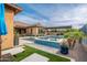 Luxury backyard featuring a pool, spa, patio and deck chairs with desert landscaping for relaxing at 5428 E Windstone Trl, Cave Creek, AZ 85331