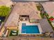 Backyard oasis with pool, spa, covered seating area, putting green, and desert landscaping offers privacy and luxury at 5428 E Windstone Trl, Cave Creek, AZ 85331