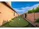 This backyard features a well-maintained putting green, providing a fun and relaxing outdoor activity at 5428 E Windstone Trl, Cave Creek, AZ 85331