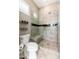 Elegant bathroom with a walk-in shower that features gray tile and a built in bench and toiletry niche at 5428 E Windstone Trl, Cave Creek, AZ 85331