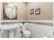 Well-lit powder room with modern fixtures and decorative accents at 5428 E Windstone Trl, Cave Creek, AZ 85331