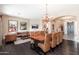 Elegant dining room featuring a large chandelier and hardwood floors at 5428 E Windstone Trl, Cave Creek, AZ 85331