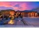 Beautiful sunset view of the property with desert landscaping and a charming stone walkway at 5428 E Windstone Trl, Cave Creek, AZ 85331