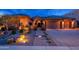 Inviting front exterior featuring desert landscaping and a charming stone pathway to the entryway at 5428 E Windstone Trl, Cave Creek, AZ 85331