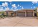 Charming home featuring a three-car garage, low maintenance landscape, and desert-friendly design at 5428 E Windstone Trl, Cave Creek, AZ 85331