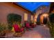 Home's front entrance features a brick walkway, stone facade, and gated courtyard with seating at 5428 E Windstone Trl, Cave Creek, AZ 85331