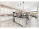 Contemporary kitchen with stainless steel appliances and an island with barstool seating at 5428 E Windstone Trl, Cave Creek, AZ 85331