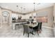 Open concept kitchen with a black granite island and attached breakfast table at 5428 E Windstone Trl, Cave Creek, AZ 85331