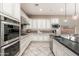 Bright kitchen with a view and stainless steel appliances, including a built in range at 5428 E Windstone Trl, Cave Creek, AZ 85331