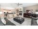 Open-concept living room featuring a fireplace and views of the modern kitchen area at 5428 E Windstone Trl, Cave Creek, AZ 85331