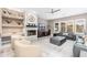 Bright living room with a fireplace, comfortable seating, a ceiling fan, and large windows at 5428 E Windstone Trl, Cave Creek, AZ 85331