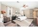 Comfortable main bedroom with a ceiling fan, stylish furniture and natural light at 5428 E Windstone Trl, Cave Creek, AZ 85331