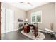 Well-lit home office with a desk, printer, and a large window at 5428 E Windstone Trl, Cave Creek, AZ 85331