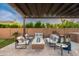 Elegant outdoor patio with a cozy fire pit and comfortable seating, perfect for entertaining guests at 5428 E Windstone Trl, Cave Creek, AZ 85331