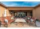 Inviting covered patio with comfortable seating and an outdoor dining area perfect for entertaining guests at 5428 E Windstone Trl, Cave Creek, AZ 85331