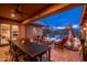 Resort-style backyard with a large pool, spa, covered patio, outdoor dining, and lush landscaping at 5428 E Windstone Trl, Cave Creek, AZ 85331